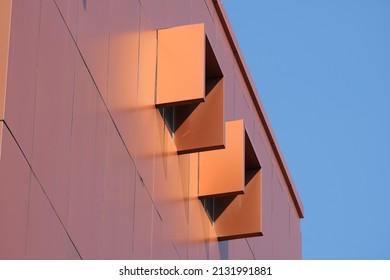 Sun-blockers on modern copper-clad building facade
