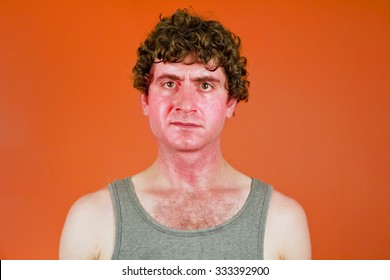 Sunburned Sweaty Man Looks Very Unhappy In Portrait