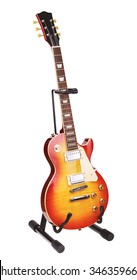 sunburst electric guitar on stand, isolated on white background