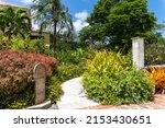 Sunbury Plantation House, Barbados. Tropical garden and old mile marker. Restored great house from gentry time of the island