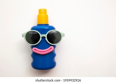 Suncream Lotion Bottle With A Happy Face And Sunglasses