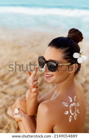 Suncream. Suntan Lotion Beautiful Woman Applying on beautiful on Face. Sunscreen Solar Cream