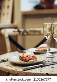 Sunday Brunch With Prosecco And Eggs And Salmon Bruschetta On Marble Table At Home On Kitchen