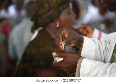 Sunday Morning Mass. The Holy Communion. Catholic Church.  Togo.  06-30-2014