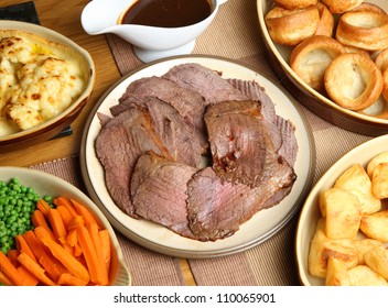 Sunday roast beef dinner in serving dishes