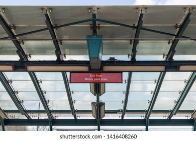 Sunderland - Great Britain / April 13, 2019 : Modern Glass Cieling Of Metro Station With Sign Saying Exit From Paid Area