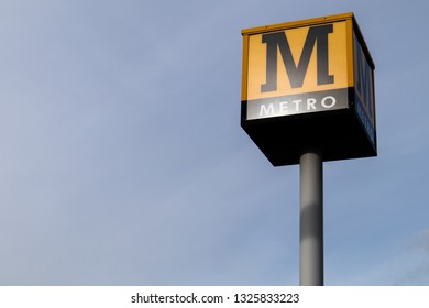 Sunderland / Great Britain - February 19,2019: Metro Sign On A Tall Pole With The Sky Behind It.  Tyneside Metro Light Rail Network In North East England