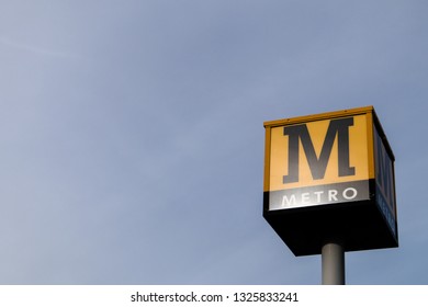 Sunderland / Great Britain - February 19,2019: Metro Sign On A Tall Pole With The Sky Behind It.  Tyneside Metro Light Rail Network In North East England