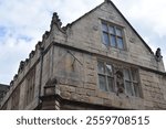 Sundial on the wall of the Old Market Hall in the town of Shrewsbury, UK.  The building was designed by Walter Hancock and finished in 1597.  Historic Elizabethan, Tudor architecture.  August 2024.