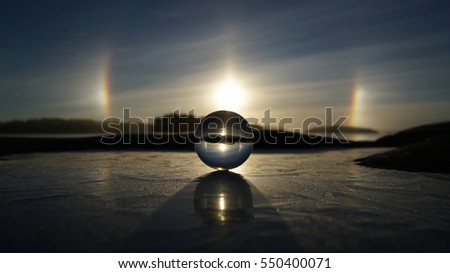 Sundogs and crystal ball with reflection