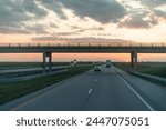  Sundown Over Highway with Overpass and Travelers Embarking on Journeys