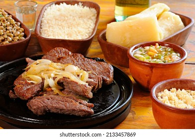 sun-dried meat with beans, rice, farofa, cassava and vinaigrette. Carne de sol. Typical dish from the Brazilian northeast.