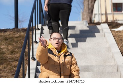 Sundsvall, Norrland Sweden - April 14, 2021: Guy With Developmental Disorder Sings From Stairs