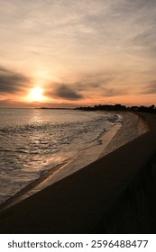 Sunfall with waves on a wall