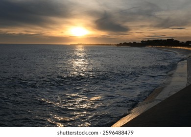 Sunfall with waves on a wall