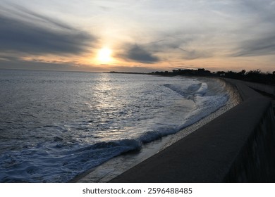 Sunfall with waves on a wall