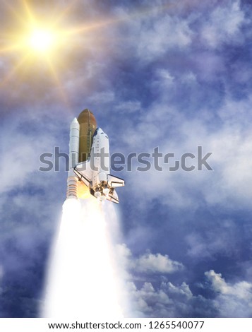 Sunflare and rocket. The elements of this image furnished by NASA.