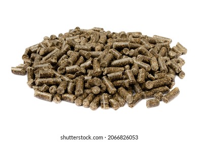 Sunflower Granulated Feed Isolated On White Background, Close-up. Pile Of Sunflower Meal Pellets Isolated On White Background. Heap Of Animal Feed Pellets Isolated On White Background.