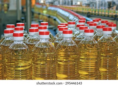 Sunflower oil in the bottle moving on production line