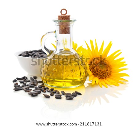 Sunflower oil in bottle with seeds and flower isolated  on white background
