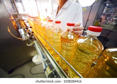 Sunflower Oil. Line For The Production And Bottling Of Refined Oil From Sunflower Seeds. Conveyor Of Food Industry