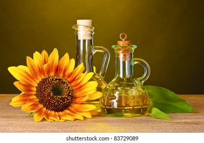 sunflower oil and sunflower on yellow background
