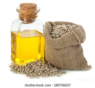 Sunflower oil and sunflower seeds in small sack isolated on white background