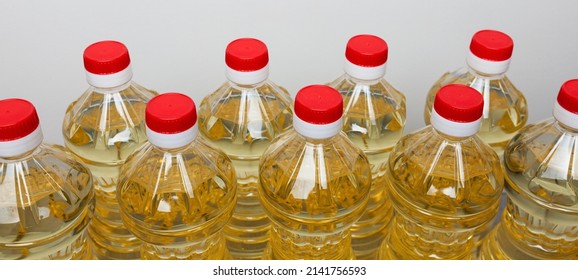 Sunflower Or Palm Cooking Oil In PET Plastic Bottles With Red Bottle Caps.