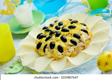 Sunflower Salad Decorated With Potato Chips, Corn, Egg And Olive For Festive Easter Dinner