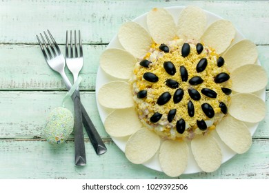 Sunflower Salad Decorated With Potato Chips, Corn, Egg And Olive For Festive Easter Dinner