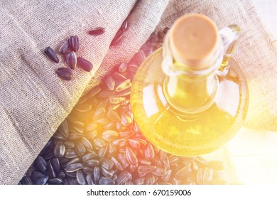 Sunflower seed and oils on wooden table