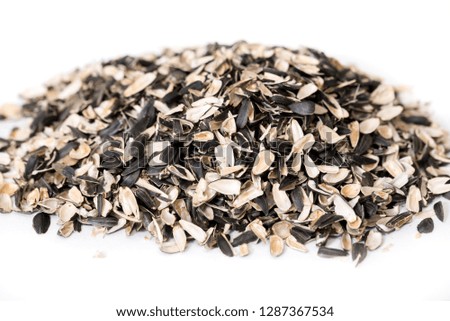 Sunflower seed shells isolated on white background. shell of seeds on a white background. a mountain of garbage from a sunflower.