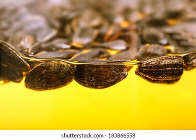 Sunflower Seeds Close Up Floating On The Vegetarian Oil