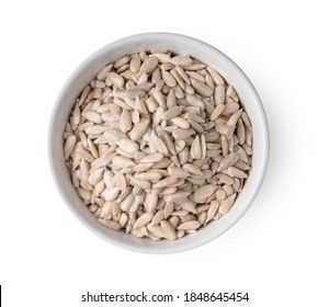 sunflower seeds in nwhite bowl isolated on white background top view