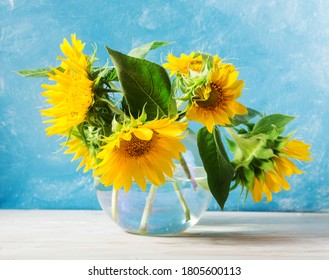 sunflowers bouquet over light blue background - Shutterstock ID 1805600113