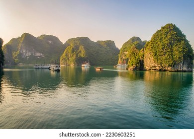 Sung Sot cave, floating fishing village, rock island, Halong Bay, Vietnam, Southeast Asia. UNESCO World Heritage Site. Junk boat cruise to Ha Long Bay. Popular landmark, famous destination of Vietnam