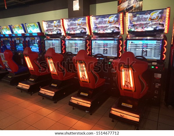 Sungai Petani, Kedah, Malaysia - 7 July 2019: Car\
driving video game machines at arcade games in the entertainment\
zone in shopping center.