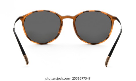 Sunglasses back view isolated on white background. Leopard color eyeglasses round frame with black uv lens against sunlight on vacation. Glasses circle shape rear view vintage and retro style for - Powered by Shutterstock