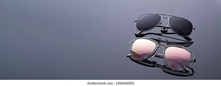 sunglasses black and rainbow chameleon assorted close-up on a black background optics panorama copy space - Shutterstock ID 2206420305