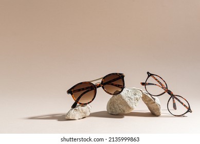 Sunglasses and glasses sale concept. Trendy sunglasses on beige background. Trendy Fashion summer accessories. Copy space for text. Summer sale. Optic store discount poster. Minimalism - Shutterstock ID 2135999863