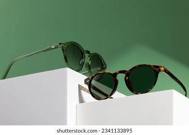 Sunglasses and glasses sale concept. Trendy sunglasses background. Trendy Fashion summer accessories. Copy space for text. Summer sale. Optic store discount poster. glasses with rounded frames. - Shutterstock ID 2341133895