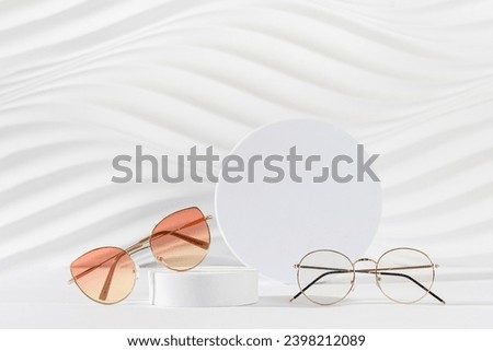 Sunglasses and glasses sale concept. Trendy sunglasses on podiums on a white background. Trendy Fashion summer accessories. Copy space. Promotion, sale. Optic store discount poster. Minimal