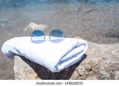 Sunglasses Lying On Tropical Sand Beach. White Towel And Glasses With Seashells. Sunglasses On The Beach. Beautiful Sea View Wallpaper, Background