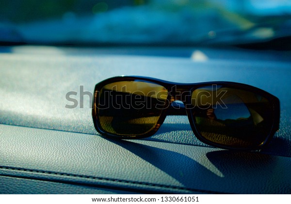 Sunglasses on Car\
Dash