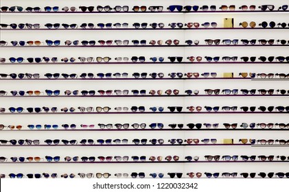  Sunglasses On Display Shelves In Glasses Store 