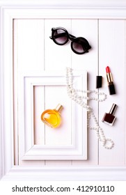 Sunglasses, Perfume And Pearls In White Frame