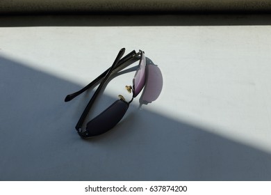 Sunglasses Put On The Table Light And Shadow