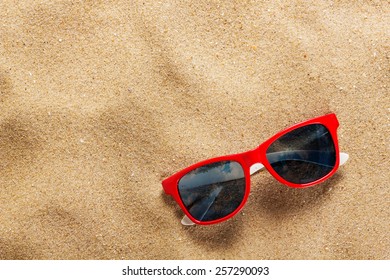 sunglasses sand