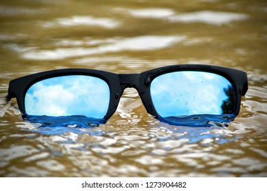 Sunglasses in water - Shutterstock ID 1273904482