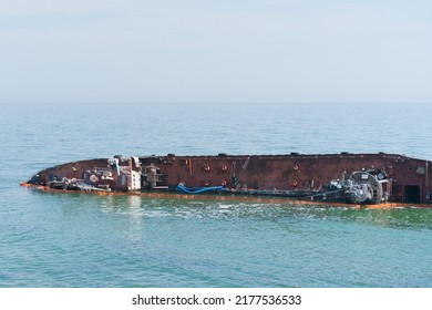 Sunken Abandoned Ship In Water. Ship Wreck, Storm, Tragedy. Blue. Decay. Ruined. Tanker. Damage. Coastline. Destruction. Huge. Mysterious. Rescue. Safety. Industry. Corrosive. Abandonment. Sorrowful